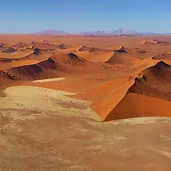 The Namib Desert, the world’s oldest desert, has been around for at least 55 million years, devoid of surface water but bisected by many dry riverbeds. The Namib Desert is one of many stunning experiences that Namibia is known for.